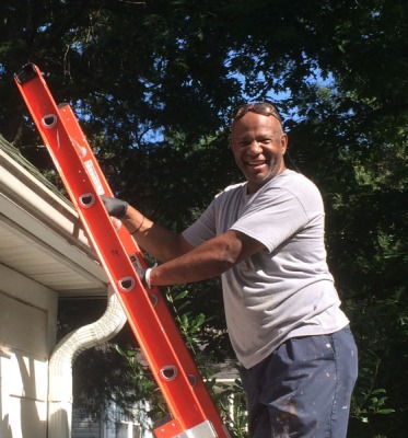 Charles Myhand cleaning gutters